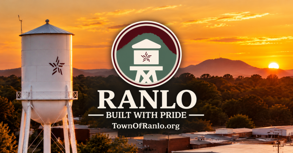 Town of Ranlo water tower at sunset with the town seal and TownOfRanlo.org wordmark